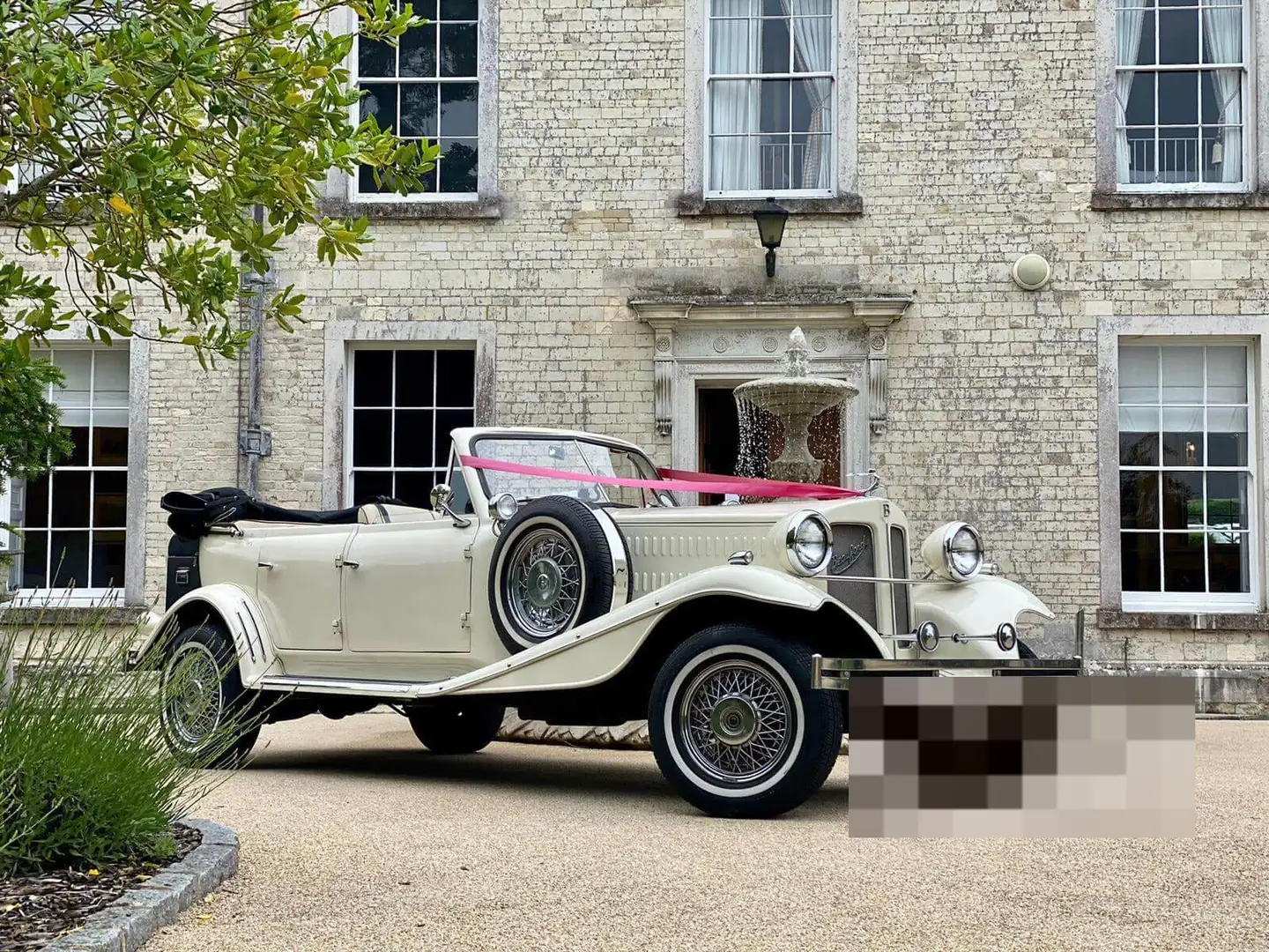 Ivory 1930s-style Beauford open tourer wedding car