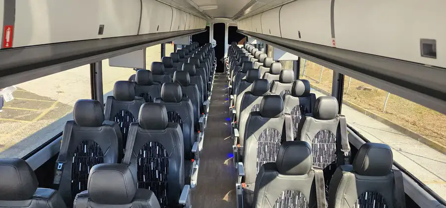 Executive charter coach with forward-facing seats
