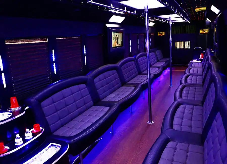 50-passenger party bus interior with red leather seating