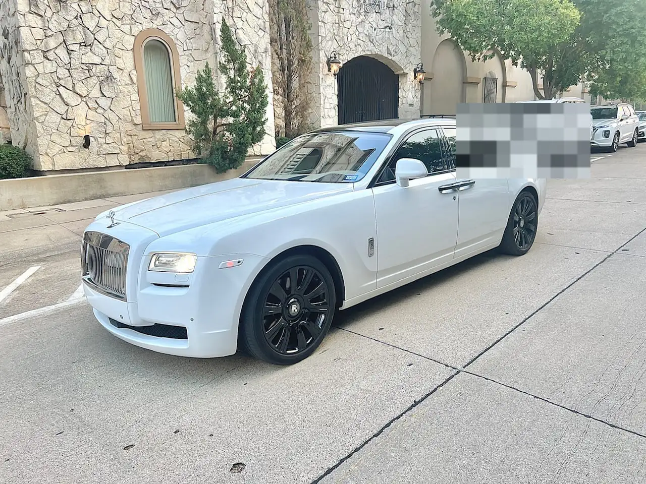 White Rolls-Royce Ghost luxury sedan