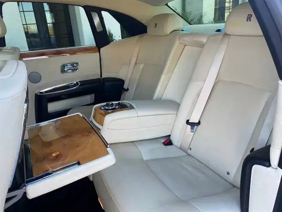 Cream leather rear cabin of a Rolls-Royce Ghost